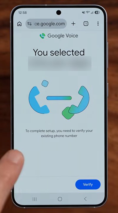 Google Voice设置页:手机上提示To complete setup you need to verify your existing phone number,选中的号码已遮